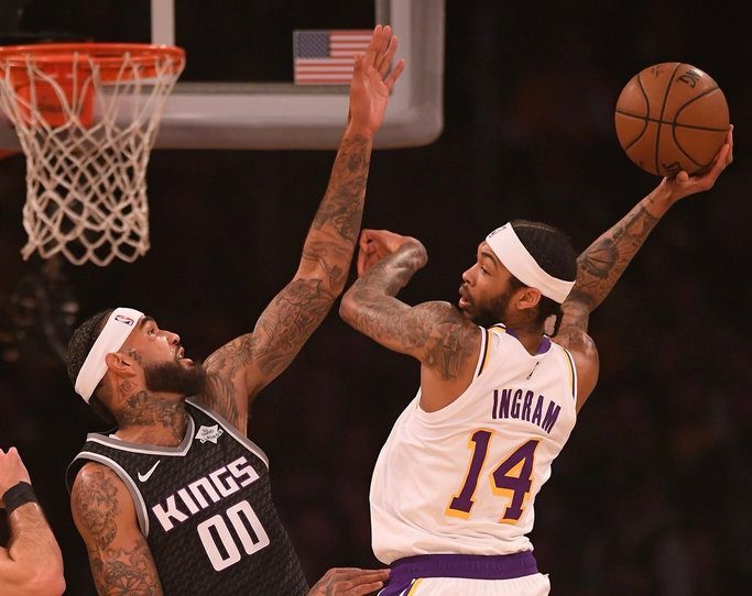 Lakers trip Kings, earn first win minus injured LeBron