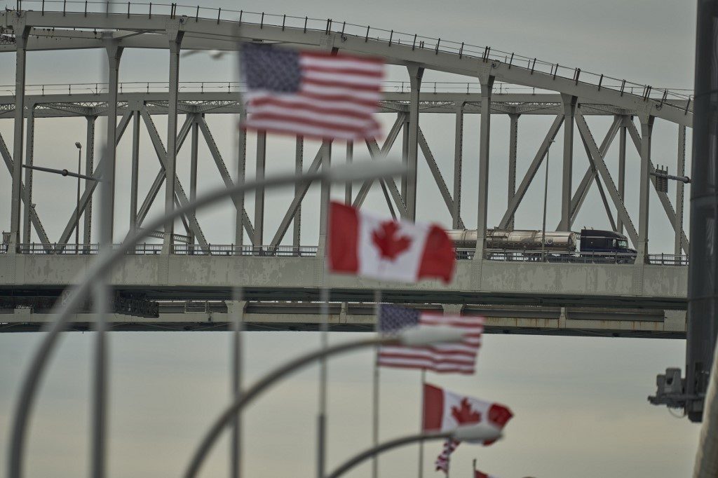 Canada border opens to foreign families of Canadians