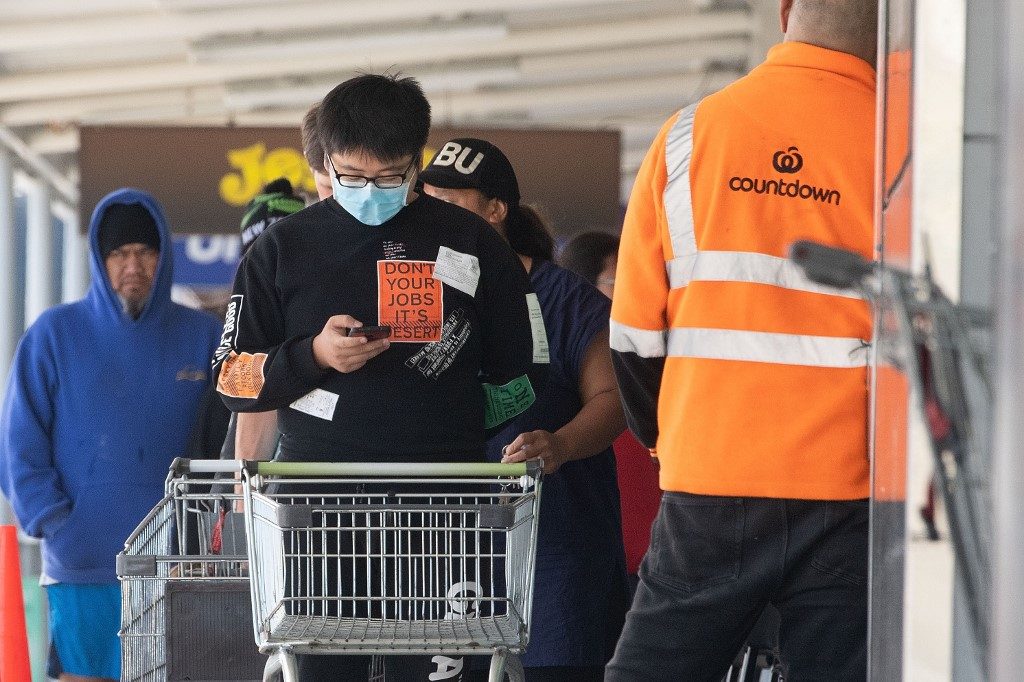 Ferries, airports swamped as Kiwis rush home for virus lockdown