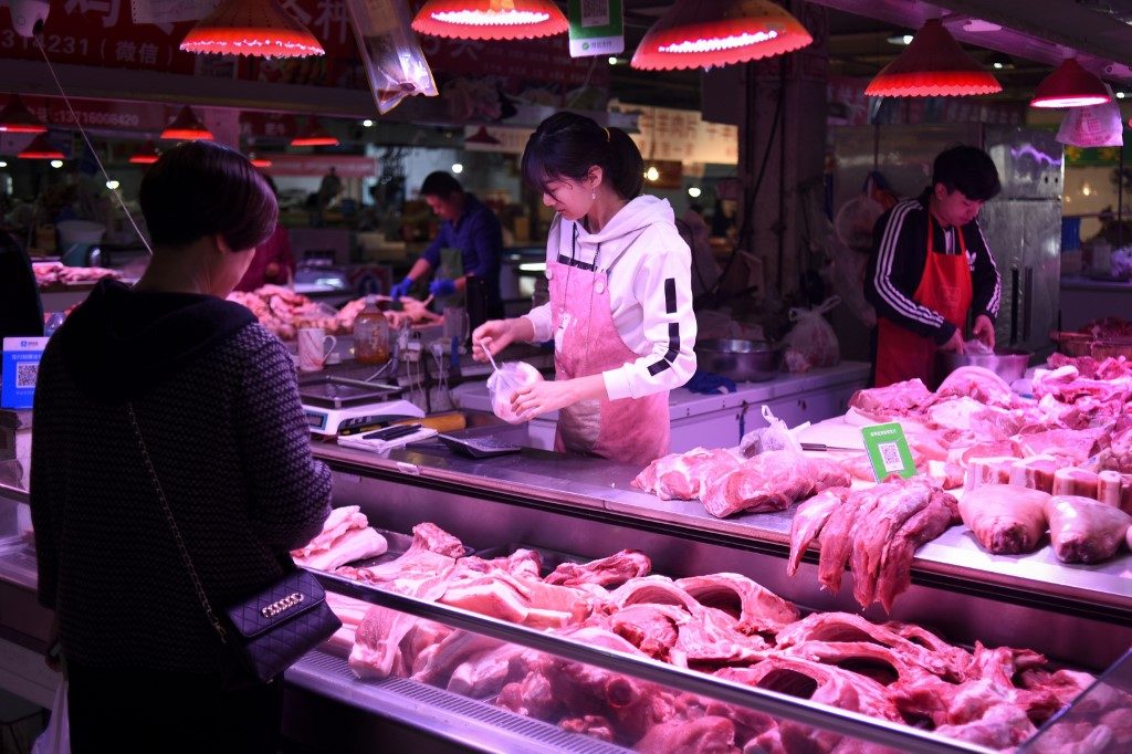 CHINA INFLATION. A customer shops for pork at a market in Beijing on October 15, 2019. File photo by Wang Zhao/AFP 