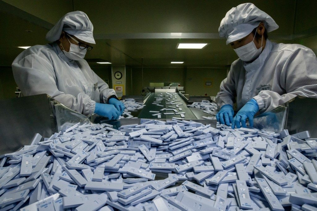 Coronavirus test kits pour off South Korean production line