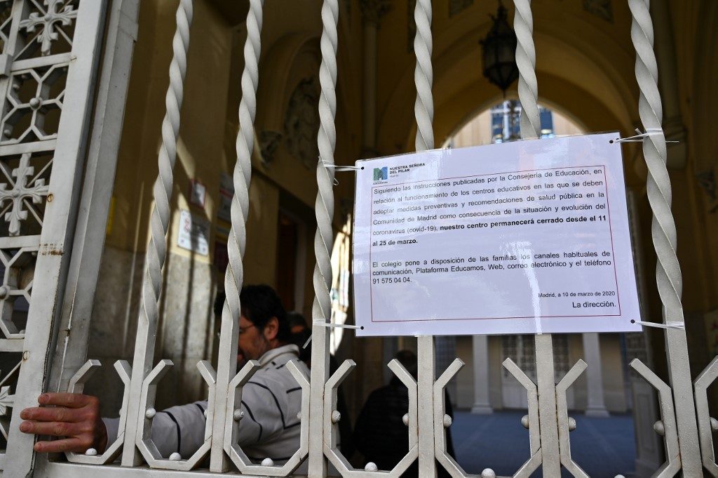 Spain imposes near total lockdown to fight virus