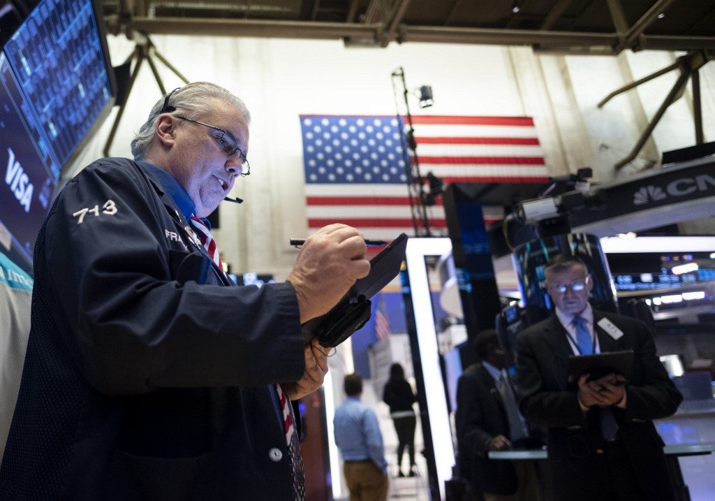 Late surge lifts Wall Street stocks as coronavirus hits economy