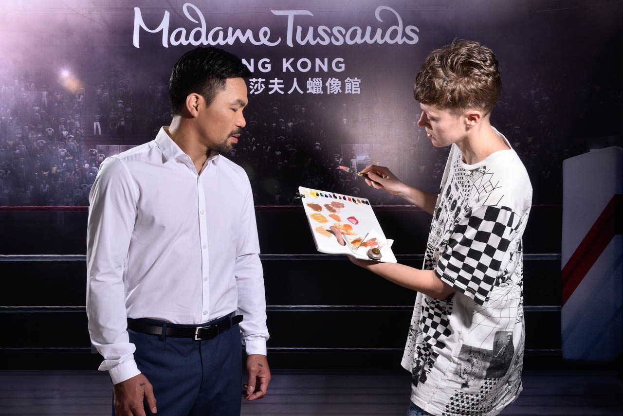 FRIENDLY STAFF. Manny Pacquiao has fun with Madame Tussauds staff in the UK. Photo from Madame Tussauds Hong Kong 