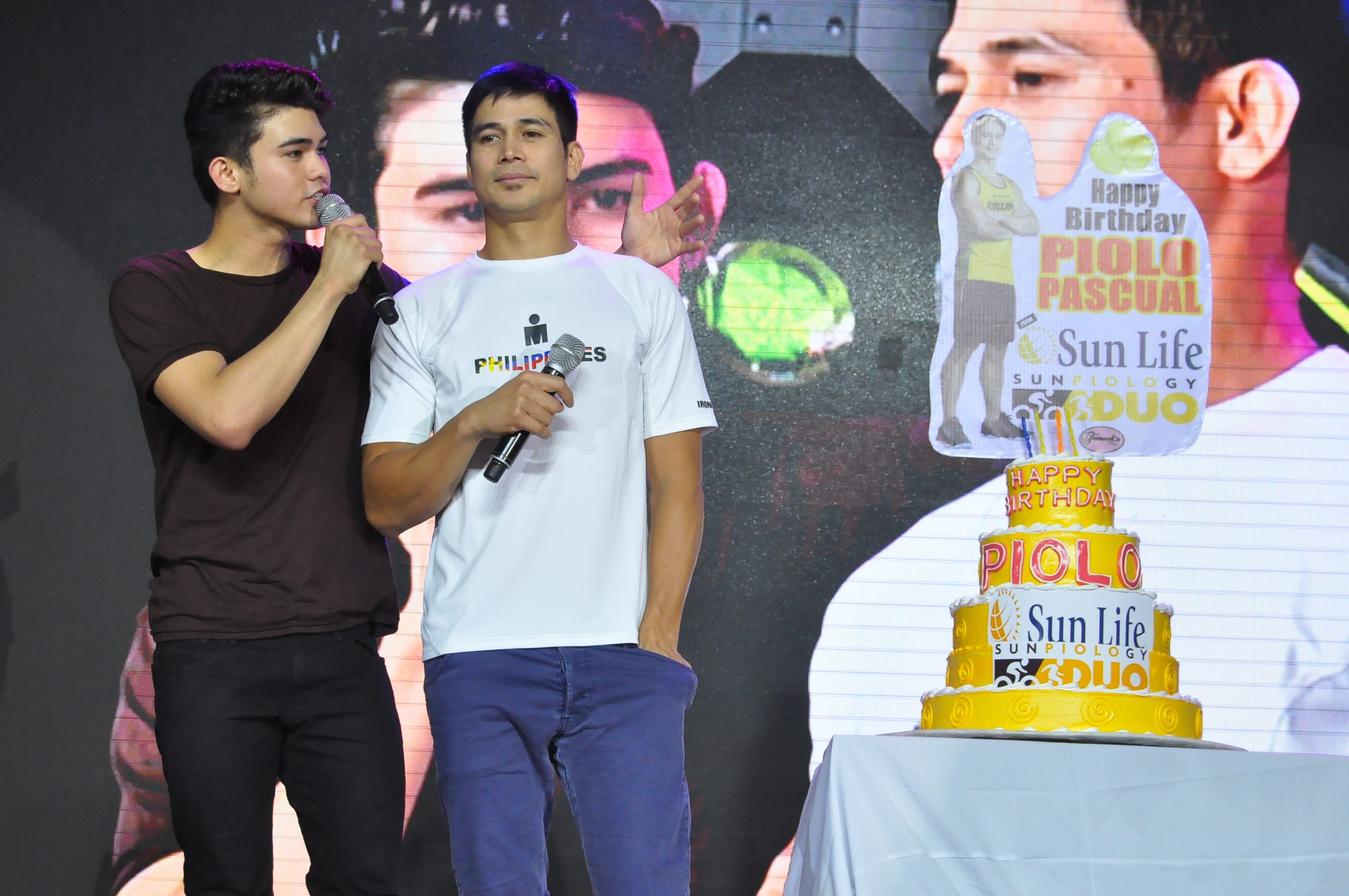 BIRTHDAY SURPRISE. Inigo (Left) and Piolo Pascual (Right) treated fans in celebration of the latter's recent birthday. Photo from Sun Life 