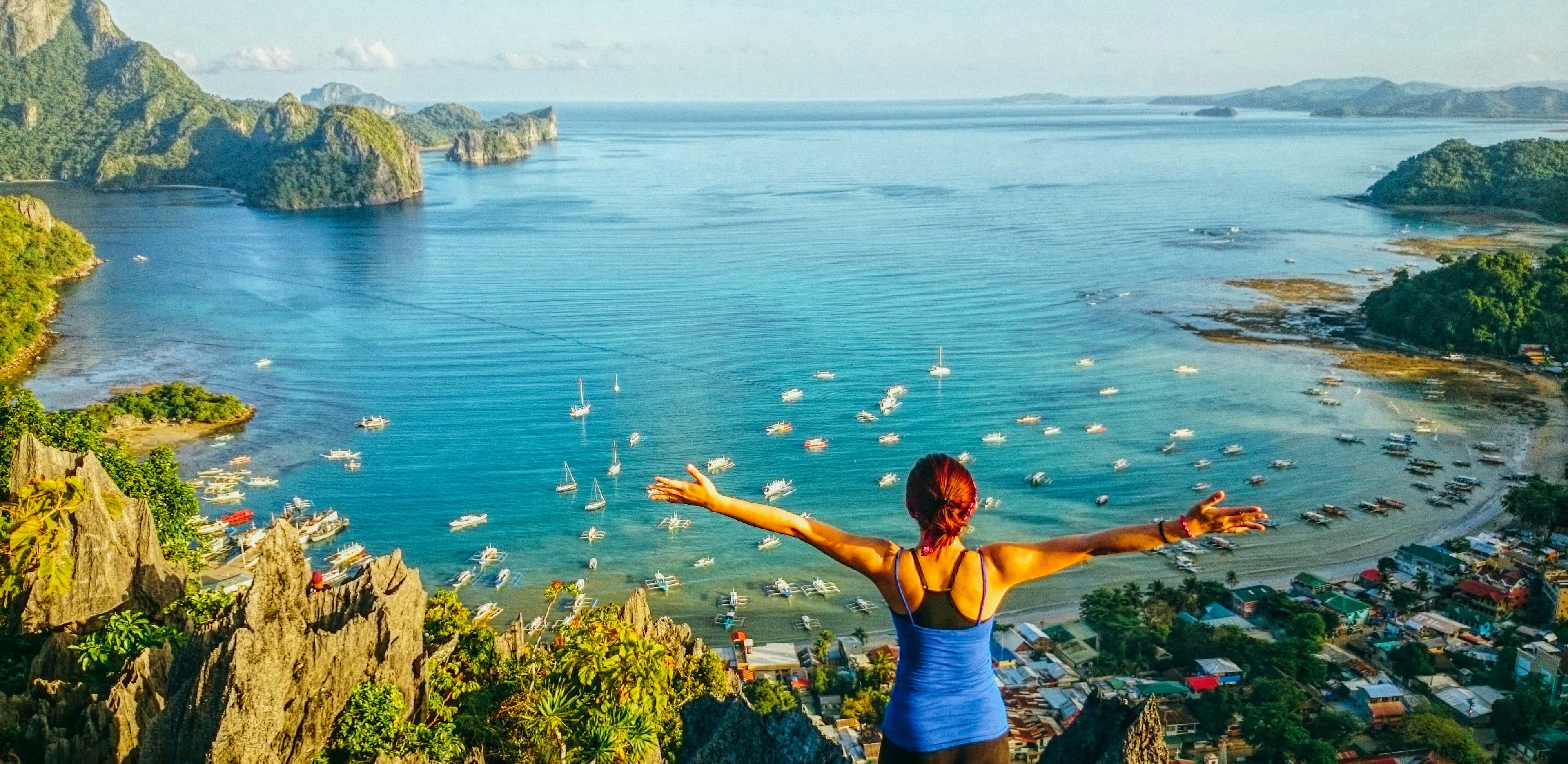 BIRD'S EYE VIEW. Take on the challenge of climbing Taraw Cliff to get an overlooking view of the town and the cerulean waters. Photo by Kacelyn Malunda (Instagram/@exploringkuting) 