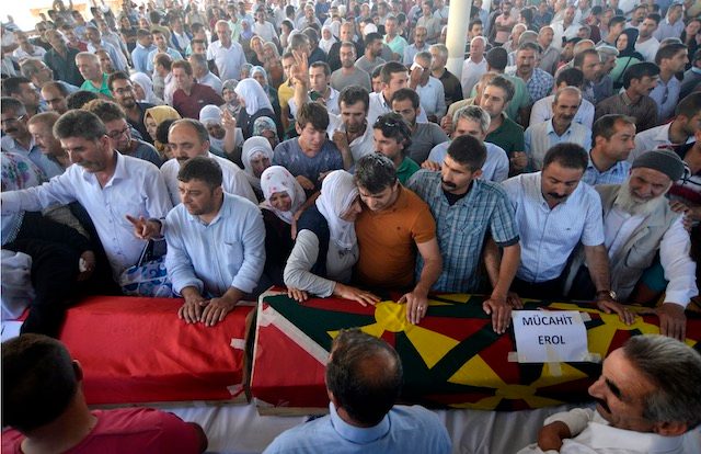 LAID TO REST. Friends and relatives of the victims, who were killed in an explosion in Suruc near the border between Turkey and Syria, mourn over coffins during a funeral of 16 of the killed, in Gaziantep, Turkey, July 21, 2015. Deniz Toprak/EPA 