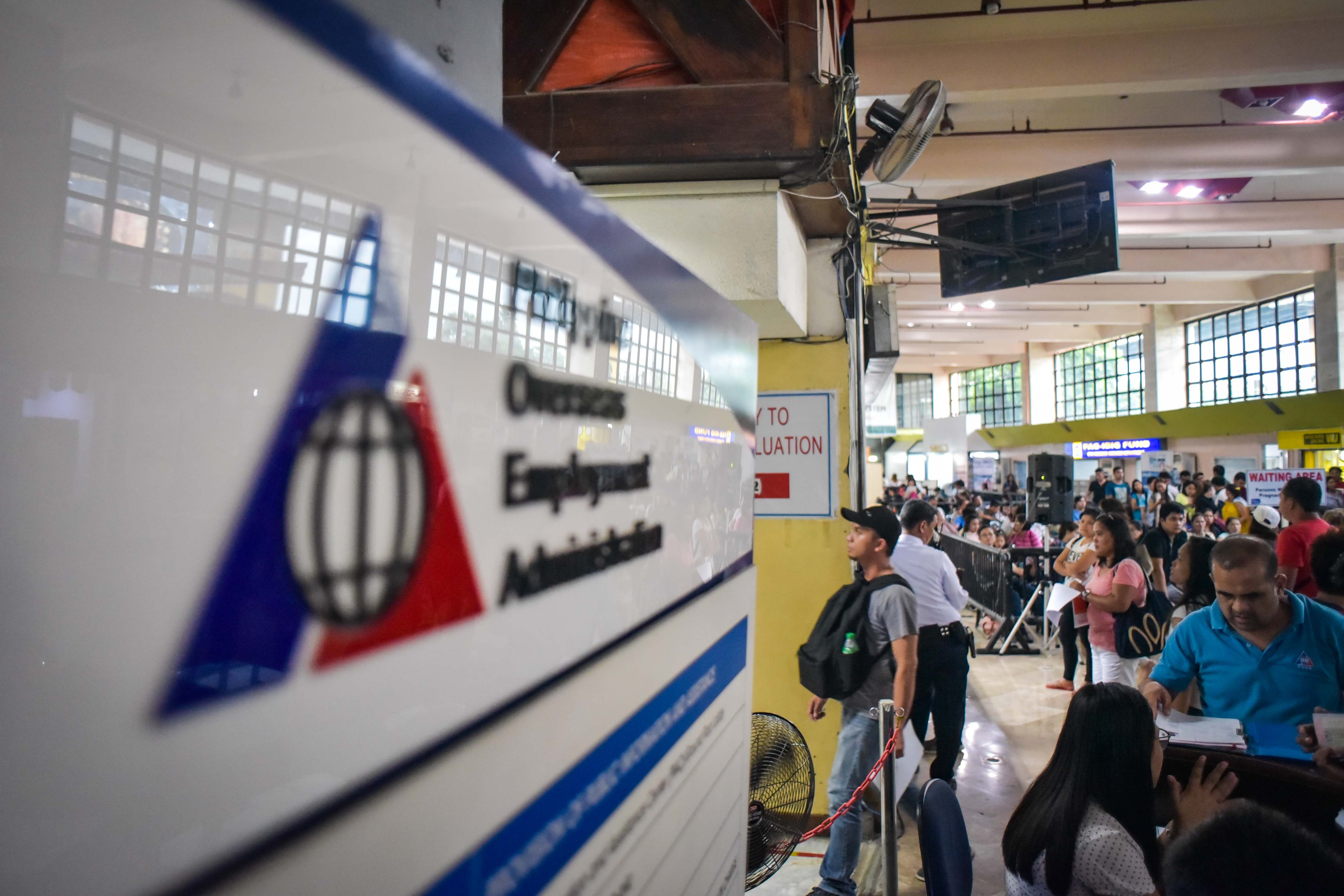 DAILY. In this photo, Filipino workers wait for their turn to avail of different services at POEA. Photo by LeAnne Jazul/Rappler  