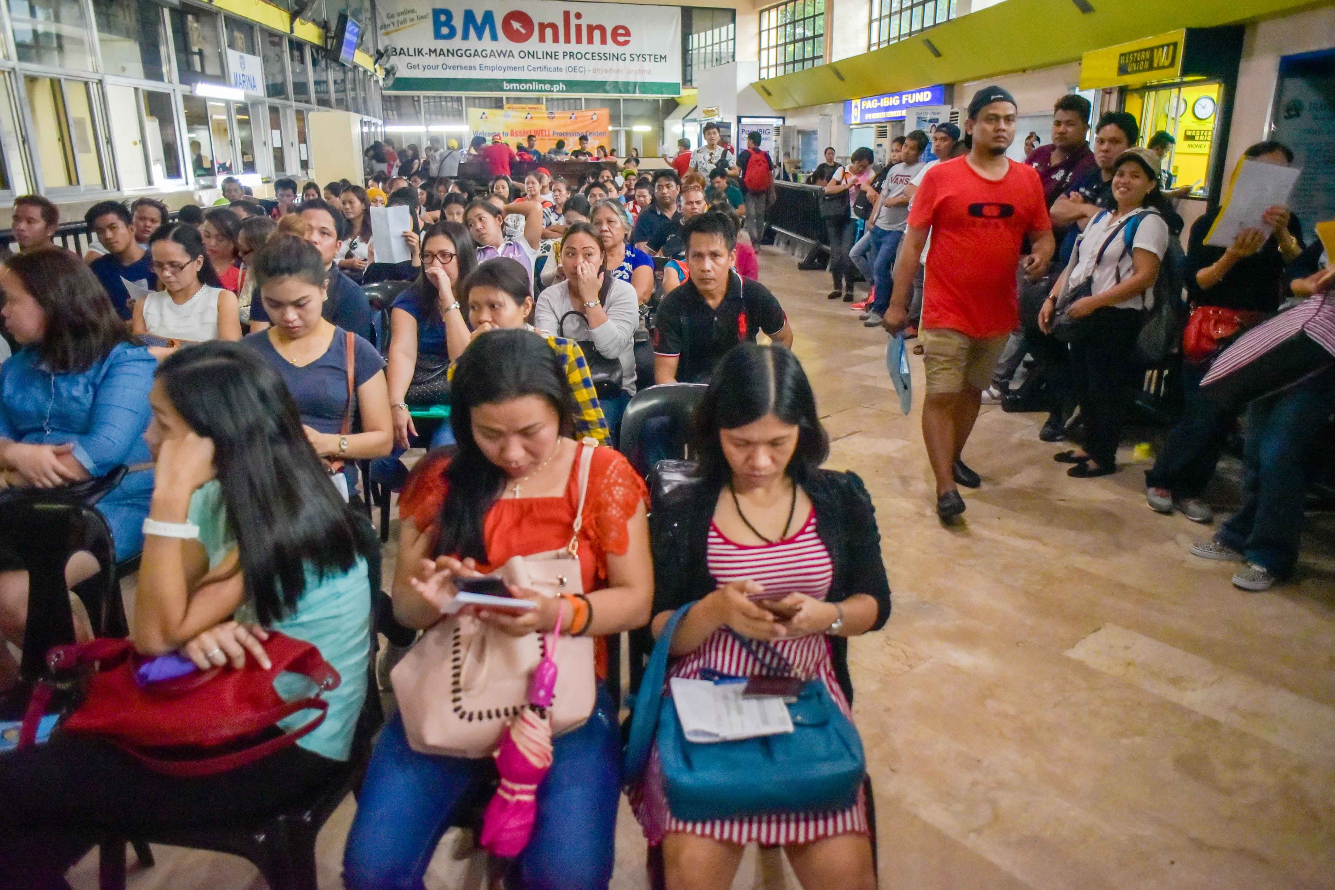 EMPLOYMENT CERTIFICATE. At least 5,000 OFWs go to the POEA to get an Overseas Employment Certificate everyday. According to DOLE, the suspension might affect around 75,000 OFWs. File photo by LeAnne Jazul/Rappler  