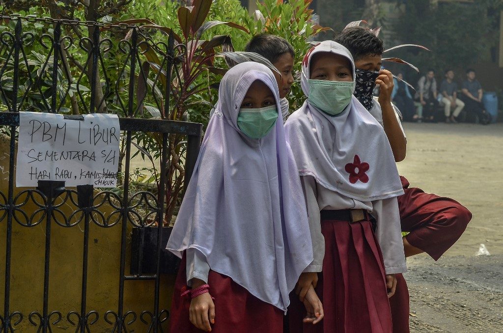Hundreds of schools shut as forest fire haze blankets Southeast Asia