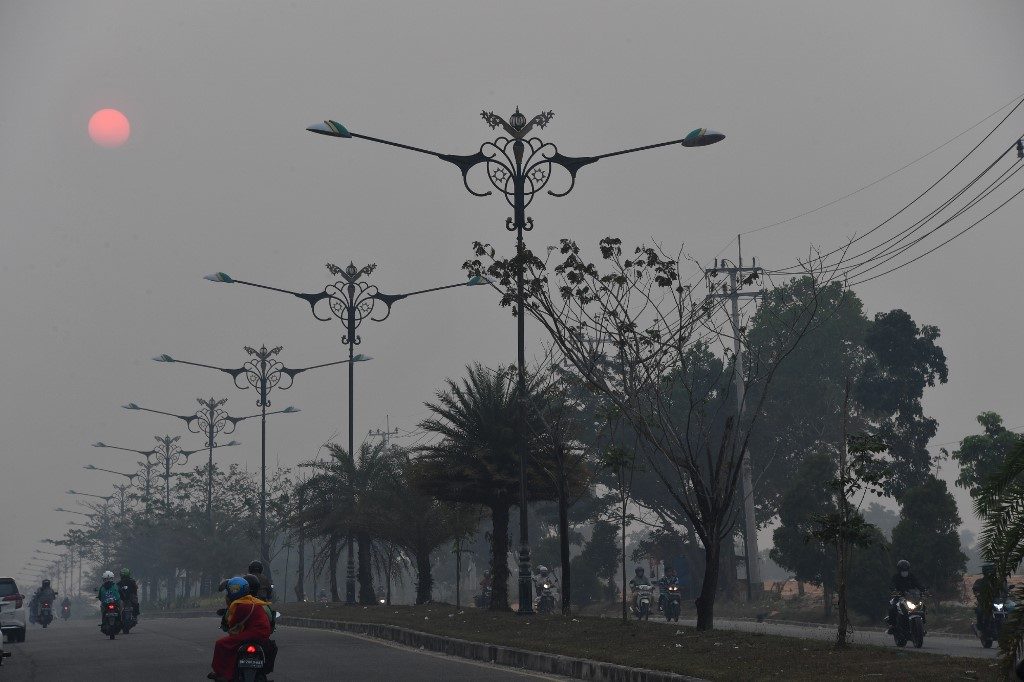 Haze closes Malaysia schools, sparks fears for Singapore F1