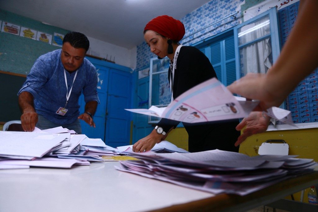 Anti-establishment figures claim first round wins in Tunisia polls