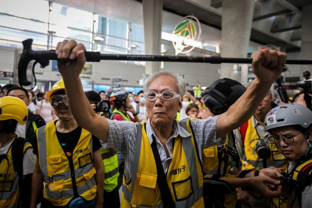 Hong Kong’s grandpa protesters speak softly but carry a stick