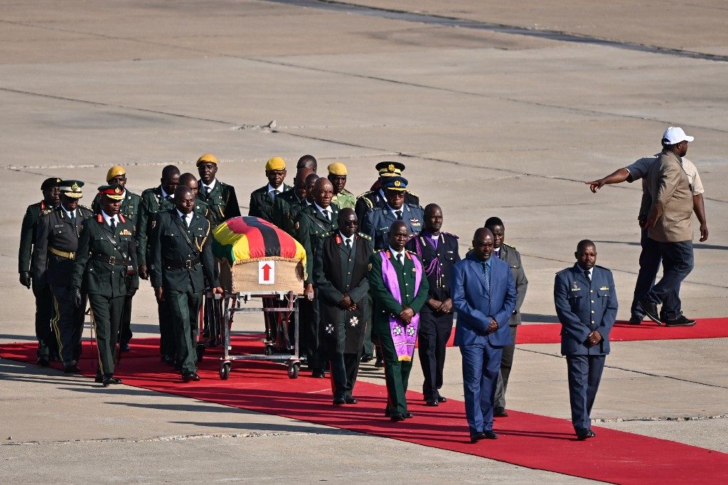 Mugabe’s body arrives home for burial in divided Zimbabwe