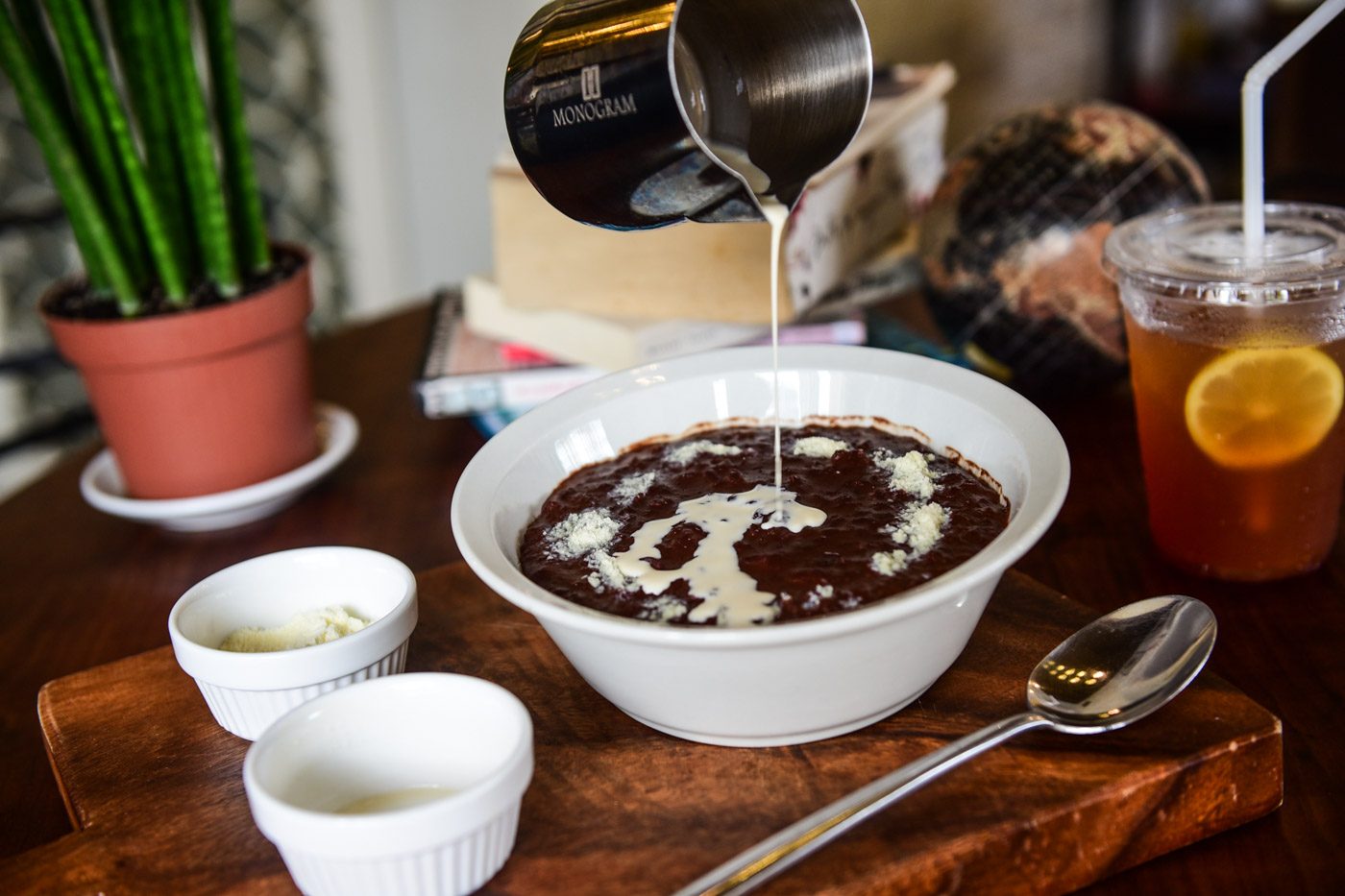 CHAMPORADO. At The Giving Cafe, they take into consideration people's preferences, giving them a choice between powdered and condensed milk. Photo by Alecs Ongcal/ Rappler 