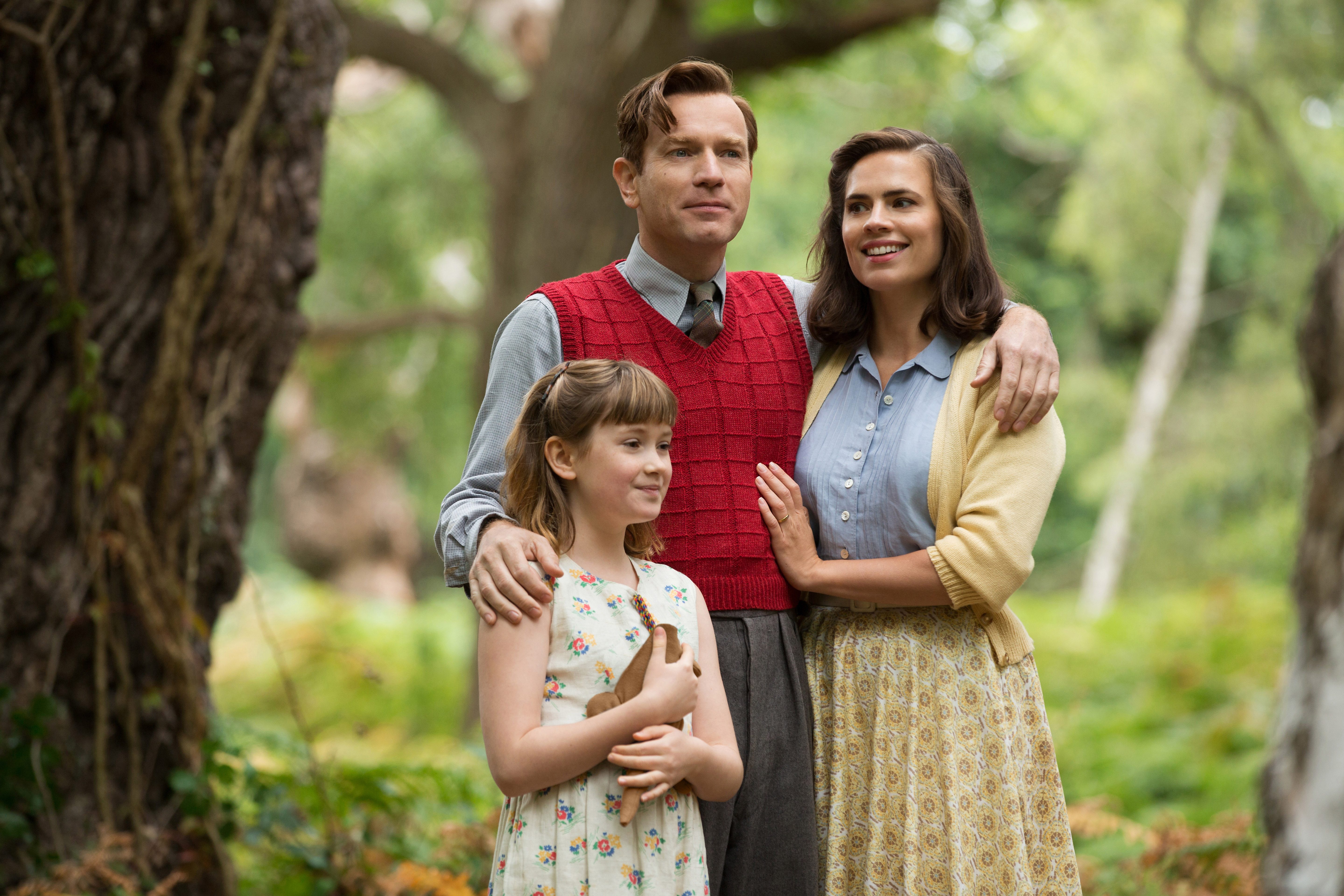 GROWN UP.  Christopher Robin now grown up with his family- daughter Madeline and wife Evelyn. 