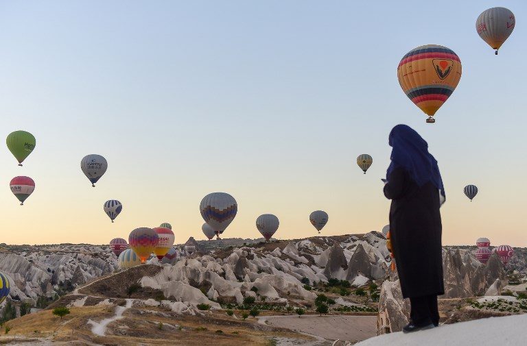 MORNING RIDE. Hot air balloons glide during a flight over Nevsehir in Turkey's historical Cappadocia region, Central Anatolia, Turkey, on September 5, 2017.Photo by Yasin Agkul/AFP 