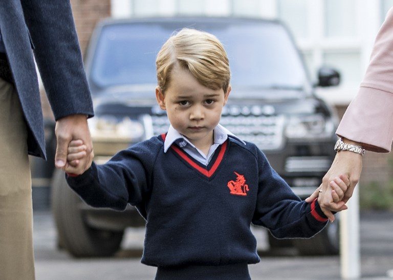 THE PRINCE GOES TO SCHOOL. Britain's Prince George accompanied by Britain's Prince William, Duke of Cambridge (left) arrives for his first day of school at Thomas' school where he is met by Helen Haslem (right), head of the lower school in London on September 7, 2017. Photo by Richard Pohle/AFP/Pool 