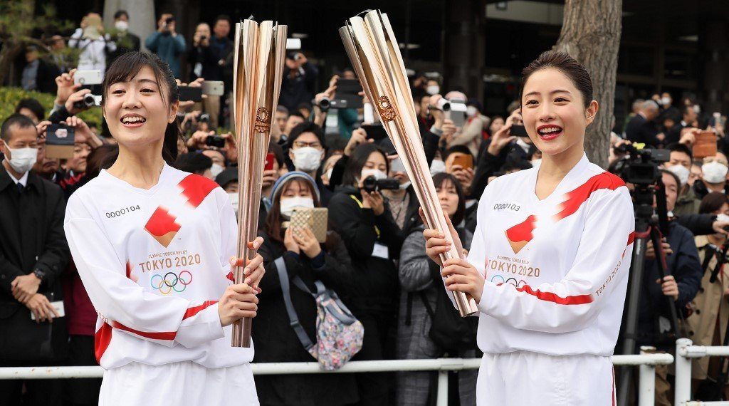 Tokyo holds Olympic torch rehearsal as specter of virus looms