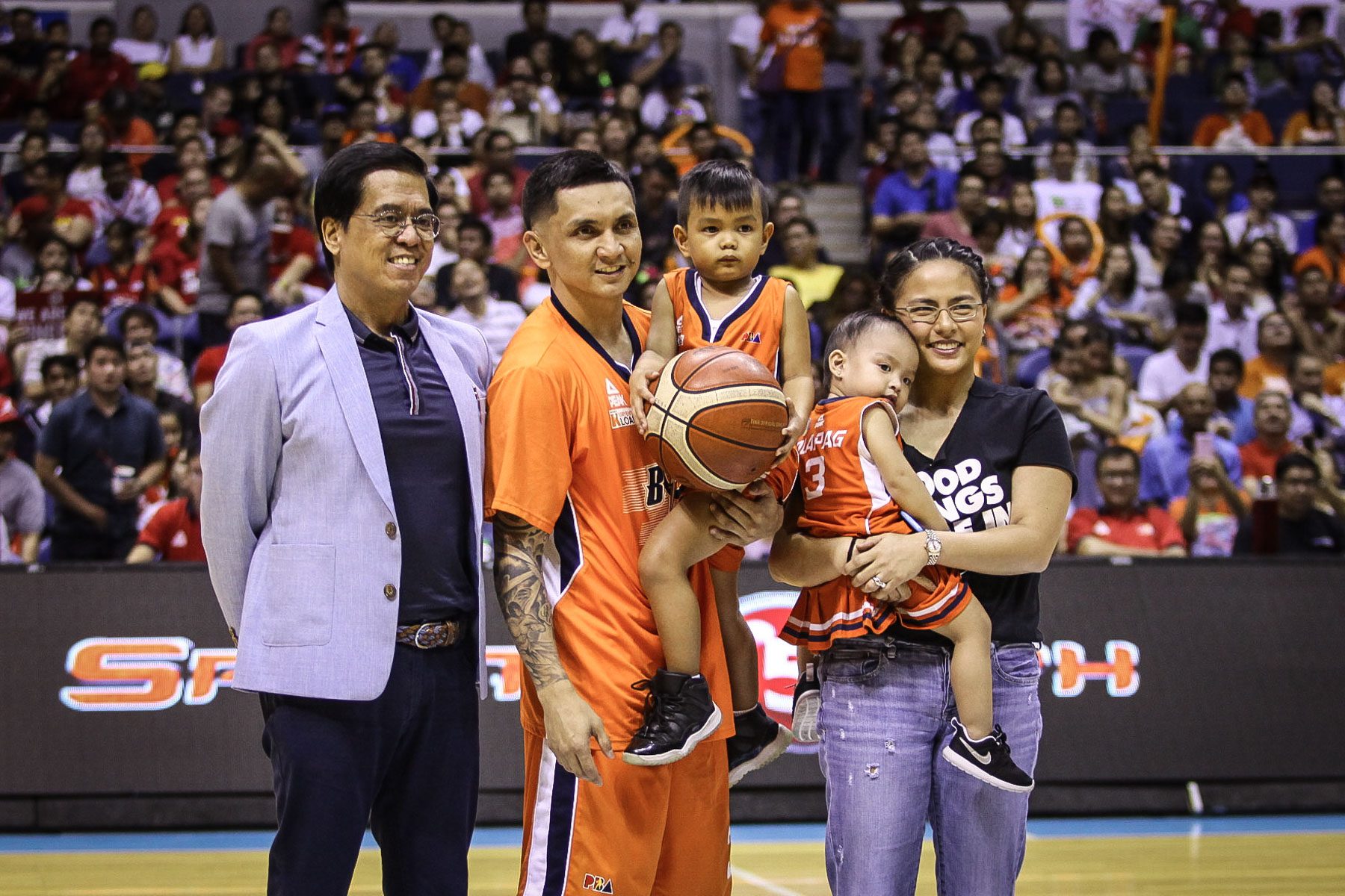 ALL-TIME 3-POINT RECORD. Jimmy Alapag, playing for Meralco, is honored with his family at halftime of Game 2 of the 2016 Governors' Cup Finals in October 2016, after he made his 1,243rd career 3-pointer and surpassed Allan Caidic for a new new all-time PBA record for most triples. File Photo by Josh Albelda/Rappler  