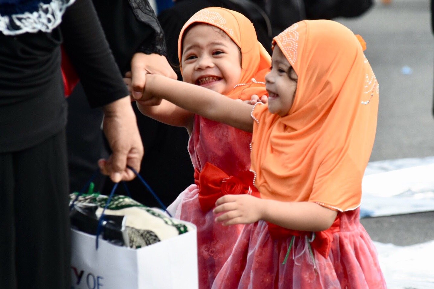 HOPE FOR THE FUTURE. Two young Muslims smile during the Eid'l Fitr celebration at the Quirino Grandstand in Manila on June 15, 2018. Photo by Angie de Silva/Rappler 
