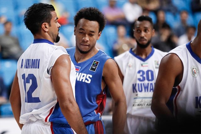 NO BACKING DOWN. Calvin Abueva (right), known to never back down against anybody, bodies up with Kuwait's Abdulaziz Alhamidi. Photo from FIBA 