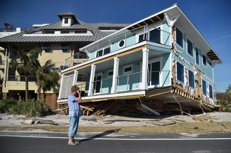 GONE. Claire mourns as she sees the damage caused by Hurricane Michael in Mexico Beach, Florida, on October 12, 2018. Photo by Hector Retamal/AFP   