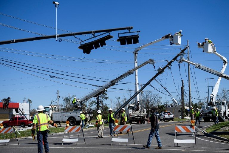 POWER RESTORATION. Utility workers repair power lines in the aftermath of Hurricane Michael in Panama City, Florida ,on October 12, 2018. Photo by Brendan Smialowski/AFP   