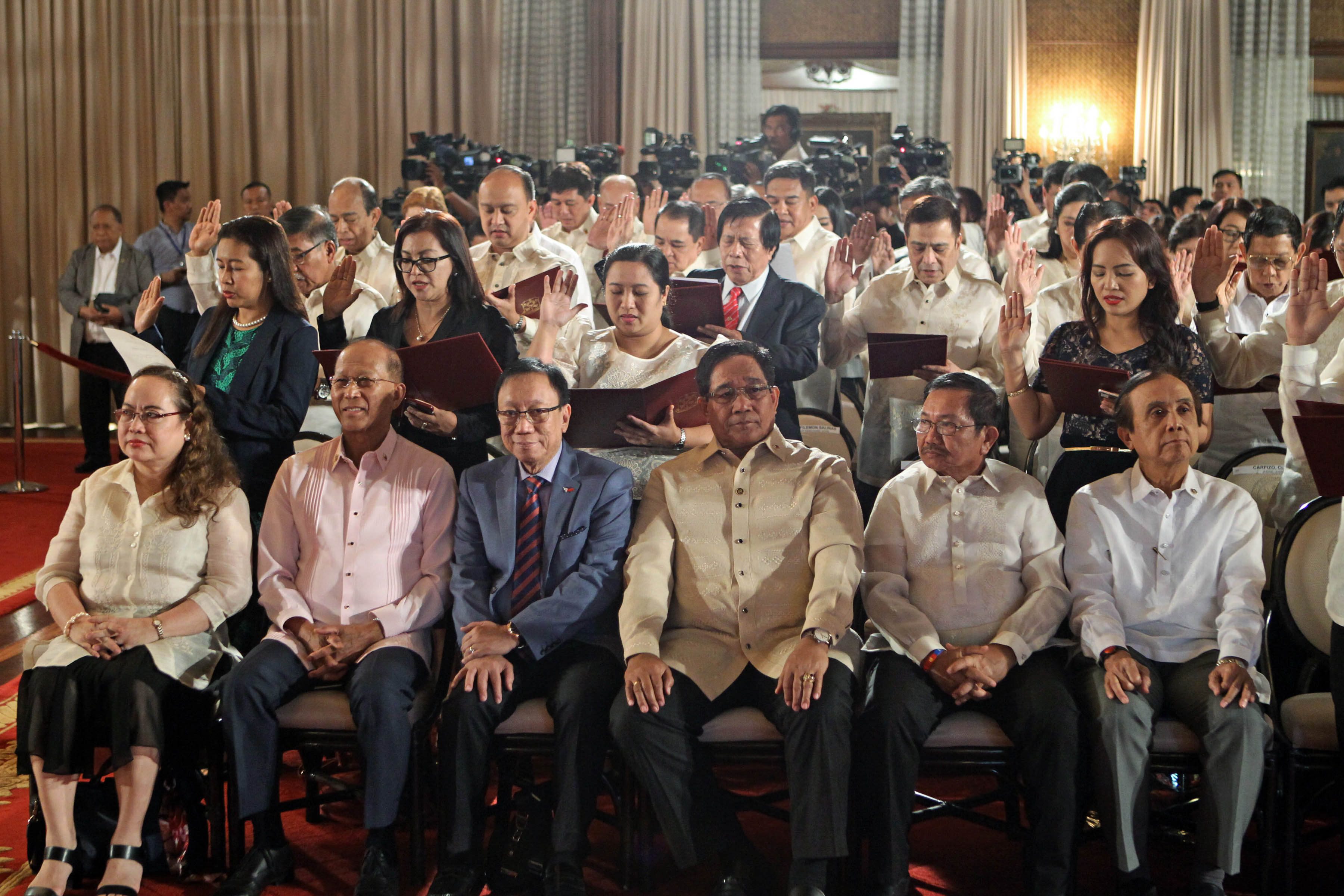 OATH-TAKING. Members of the Duterte Cabinet are seated in the front row as new government appointees are sworn in on January 9, 2017. Photo by Robinson Niñal/Presidential Photo  
