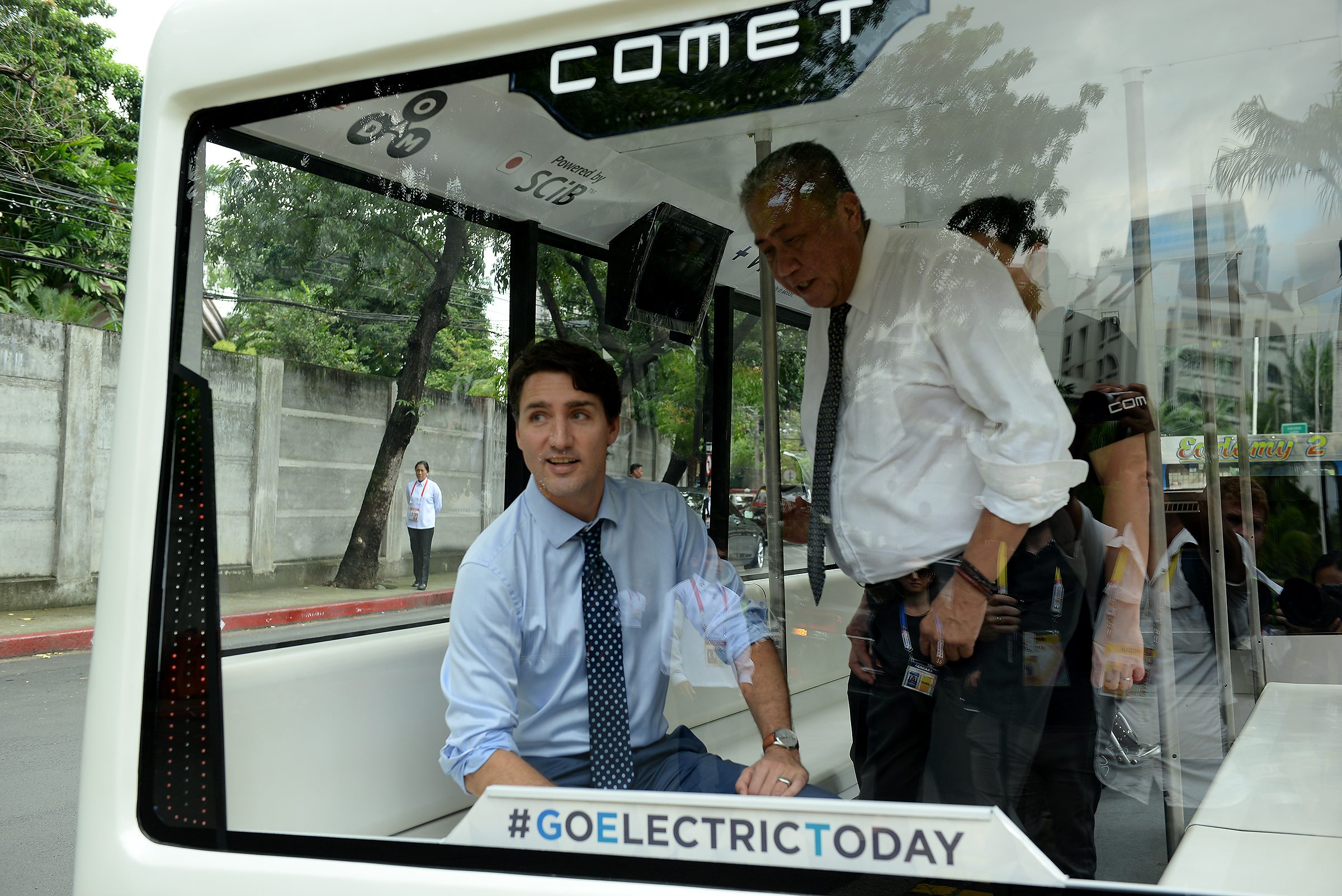 GREEN INSPECTION. Trudeau rides the COMET 3 with Philippine Transportation Secretary Arthur Tugade. Photo by Maria Tan/Rappler 