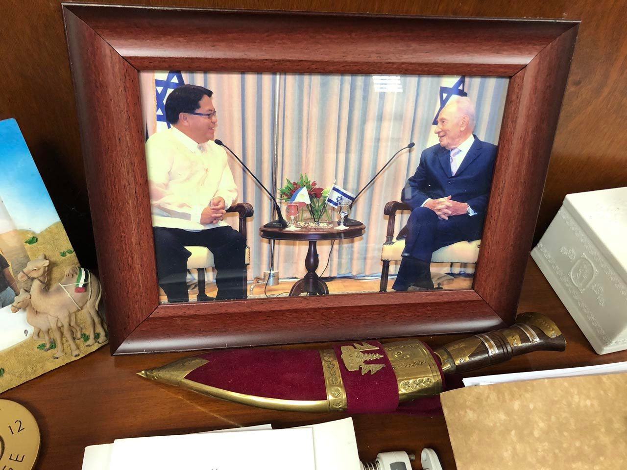 TIME IN ISRAEL. Calonge keeps a framed photo of his meeting with former president of Israel Shimon Peres in his office. Photo by Sofia Tomacruz/Rappler 