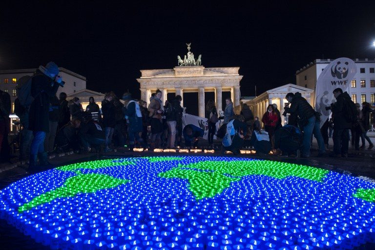 EARTH HOUR. The picture shows a globe of LED lights are lit up in front of the Brandenburg Gate shortly before the beginning of international 'Earth Hour' in Berlin, on March 25, 2017. Paul Zinken/dpa/AFP 