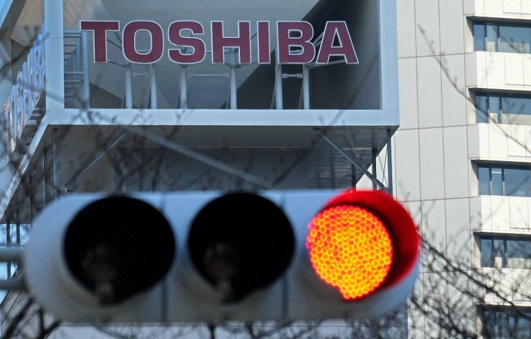Toshiba slashes 7,000 jobs, downgrades profit outlook