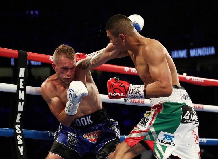 Munguia batters Cook to retain light middle crown
