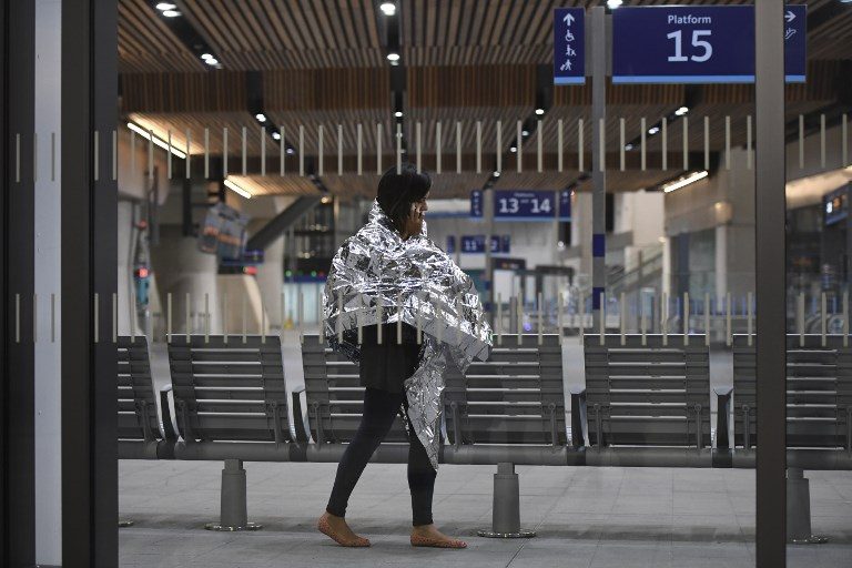 CHECKING IN. A woman wearing an emergency blanket talks on her phone at London Bridge train station on June 3, 2017 following a terror attack. Chris J Ratcliffe/AFP 