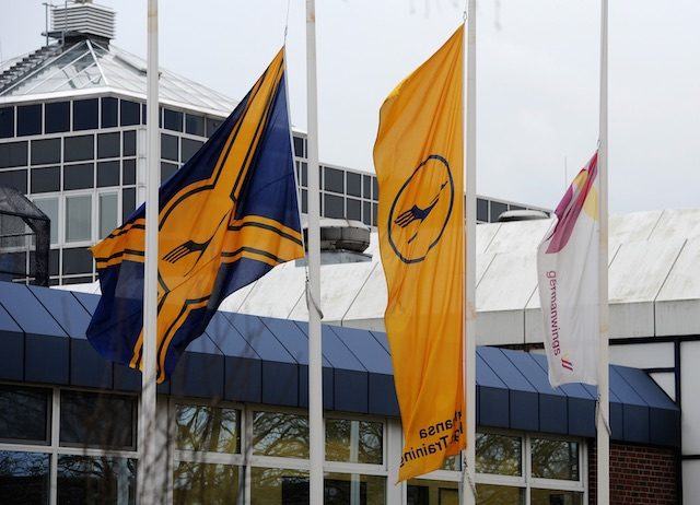 Flags of the airlines Lufthansa und Germanwings fly at half mast in front of the 'Lufthansa Flight Training' commercial pilot school in Bremen, Germany, 26 March 2015. Ingo Wagner/EPA 