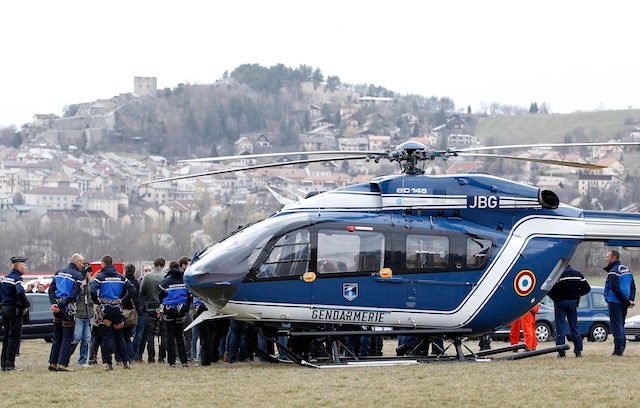 PREP FOR TAKEOFF. Members of the French Gendarmerie gather close to a helicopter in Seyne les Alpes, southeastern France, 24 March 2015, near the crash site of the Germanwings Airbus A320 in the French Alps. Sebastien Nogier/EPA 