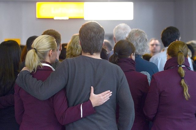 IN MOURNING. Lufthansa and Germanwings employees stand for a minute of silence at the airport in Duesseldorf, Germany, 26 March 2015. Caroline Seidel/EPA 