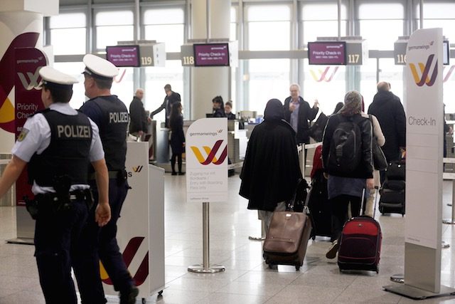 AT DUSSELDORF. Passengers walk to a counter of the airline Germanwings at the airport in Dusseldorf, Germany, 24 March 2015. Oliver Berg/EPA 
