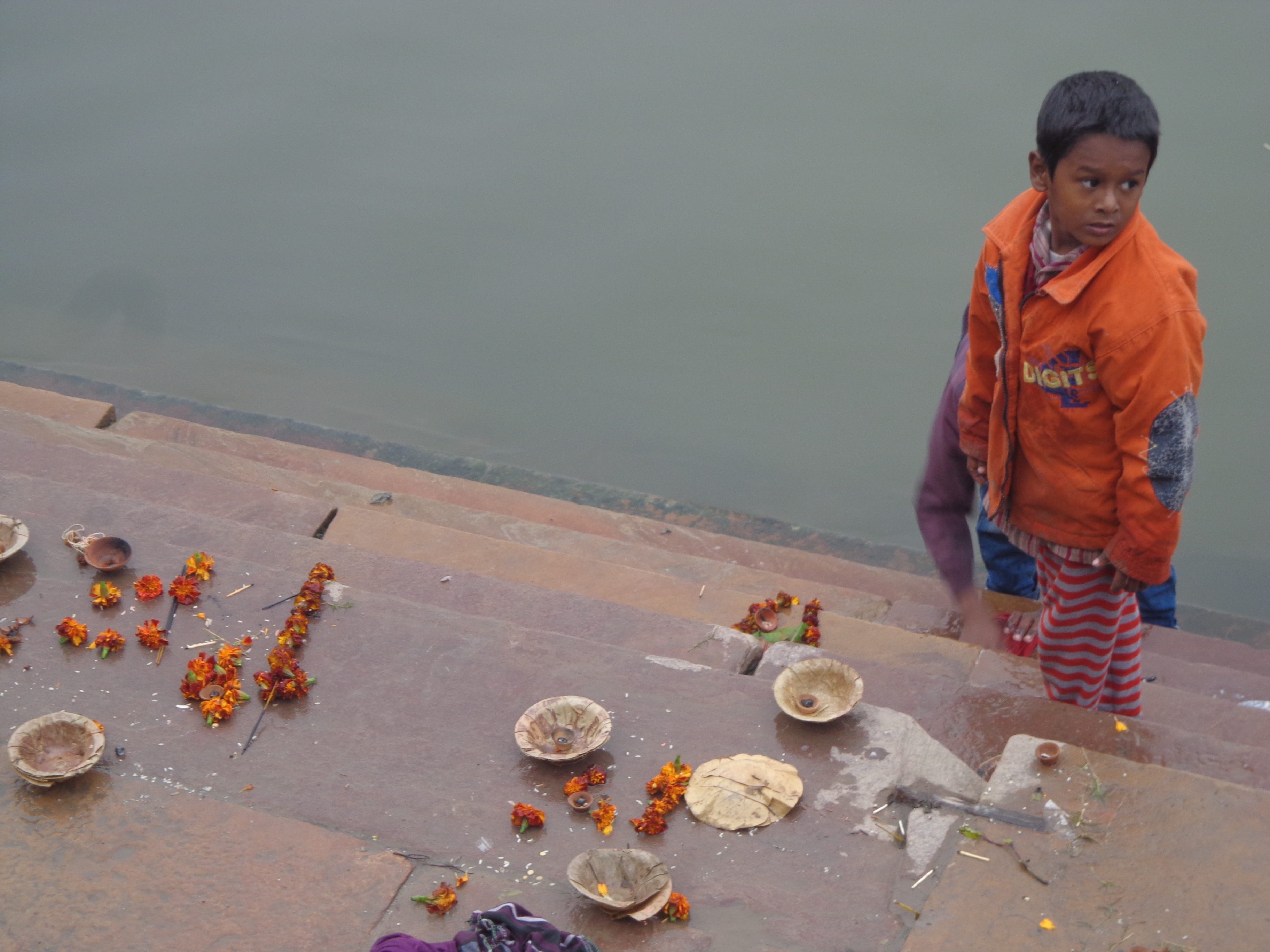OFFERINGS. Locals leave offerings along the river as a sign of respect and worship. 