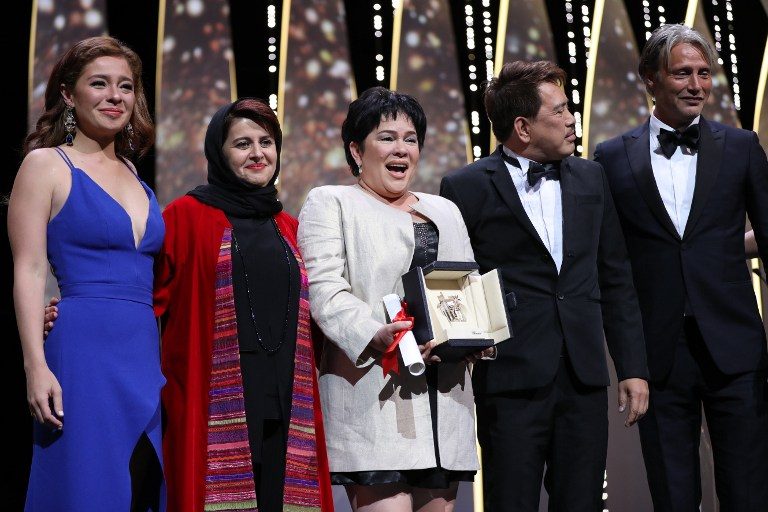 BEST ACTRESS. Jaclyn Jose poses onstage with her daughter Andi Eigenmann, Iranian producer and member of the Jury Katayoon Shahabi (2ndL), director Brillante Mendoza (2ndR), and Danish actor and member of the Jury Mads Mikkelsen after being awarded with the Best Actress prize during the closing ceremony of the 69th Cannes Film Festival in Cannes, France, on May 22, 2016. Photo by Valery Hache/AFP   