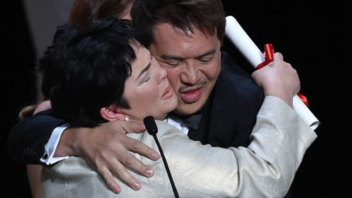 The Philippines' Jaclyn Jose (L) celebrates onstage with Filipino director Brillante Mendoza after being awarded Best Actress during the closing ceremony of the 69th Cannes Film Festival. Photo by Alberto Pizzoli/AFP 