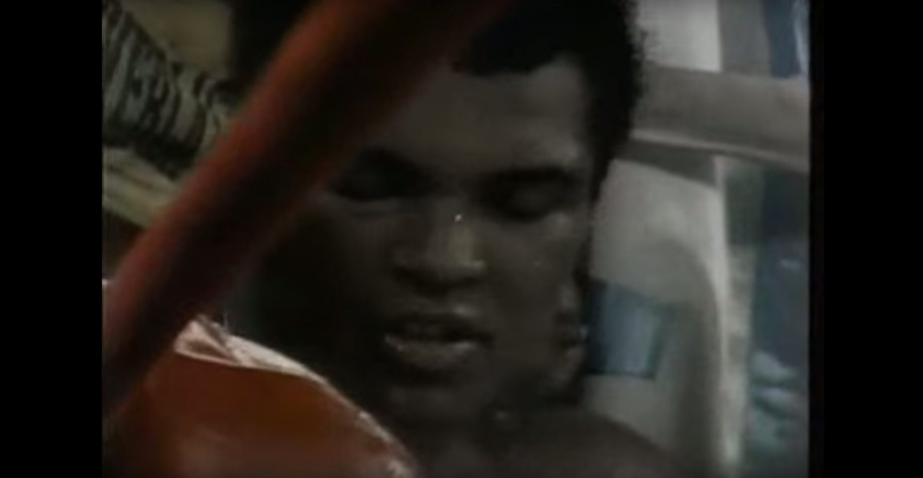 Muhammad Ali's face during the tenth round shows the damage he had incurred. Screenshot from YouTube 