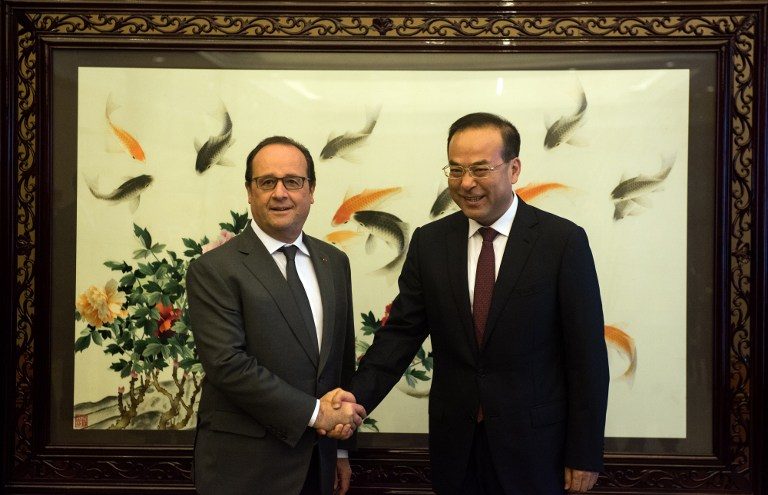 France, China agree on climate change checks
