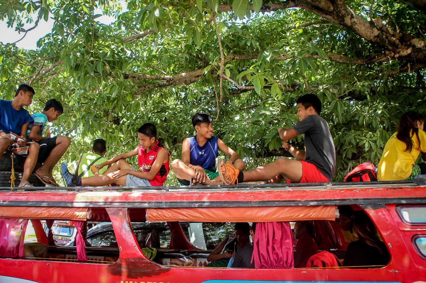 RESPITE. Athletes from Region II rest atop a jeepney prior to their practice outside  the Biniyaran Sports Complex. Photo by Jonn Aaron Metierre   