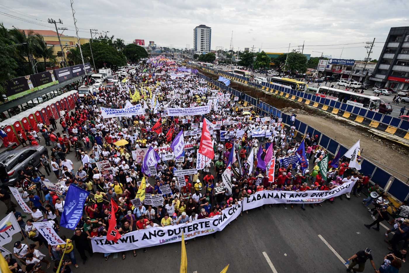 UNITED PEOPLE'S SONA. Protesters march towards Batasan along Commonwealth Ave., Quezon City during President Duterteâs 3rd State Of The Nation Address. Photo by Alecs Ongcal/Rappler 