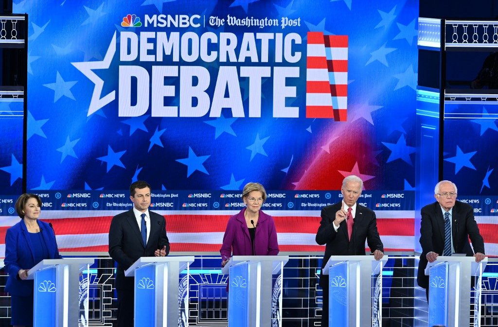 Top hopefuls Buttigieg, Sanders under fire in Democratic debate