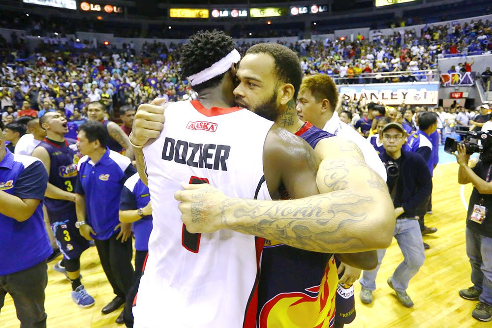 HUG. Alaska import Rob Dozier and Rain or Shine import Pierre Henderson-Niles hug it out after the hard-fought game. Photo by Josh Albelda/Rappler 