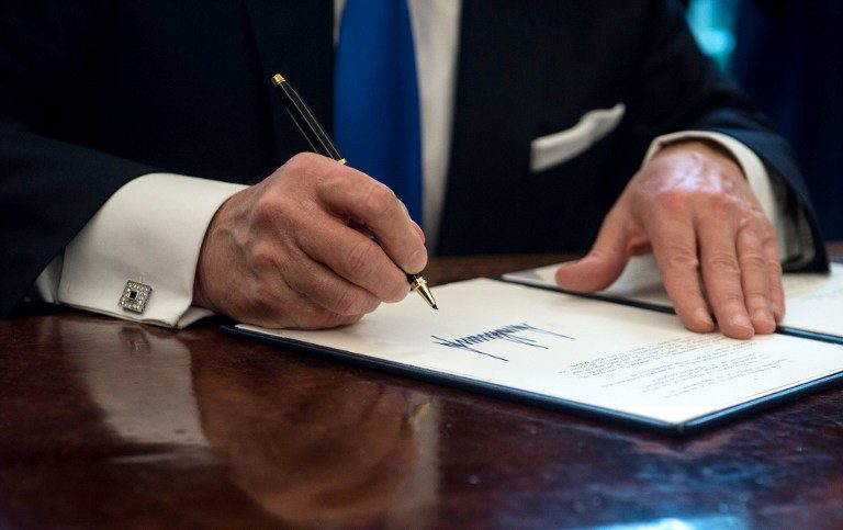 CEREMONIAL. In this file photo, US President Donald Trump signs an executive order in the Oval Office at the White House in Washington, DC, on January 24, 2017. Nicholas Kamm/AFP 