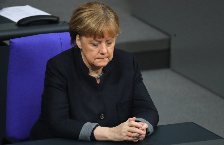 Germany’s weakened Merkel scrambles to form government